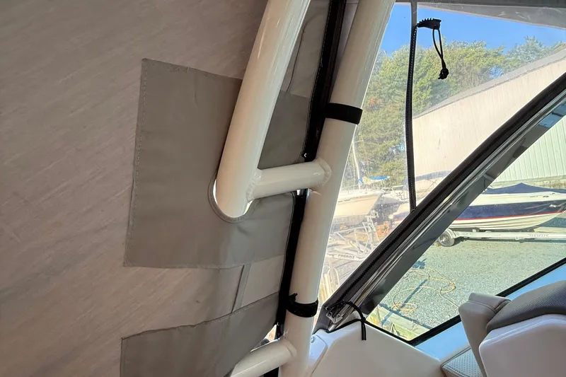  Yacht Photos Pics 2019 Pursuit DC 325 Dual Console interior with window and support structure.