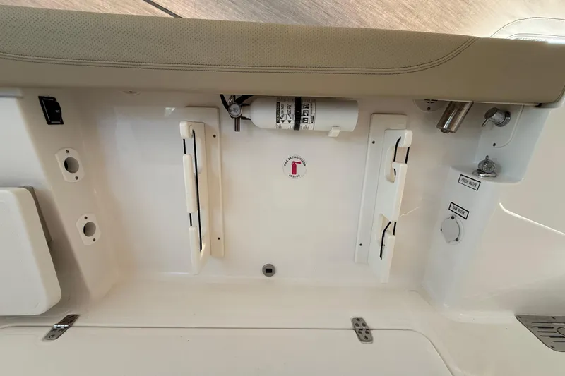  Yacht Photos Pics 2019 Pursuit DC 325 Dual Console interior with storage and control panel.