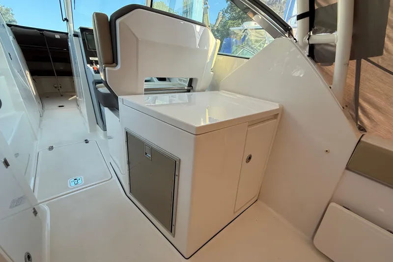  Yacht Photos Pics 2019 Pursuit DC 325 Dual Console interior with sleek cabinetry and seating.
