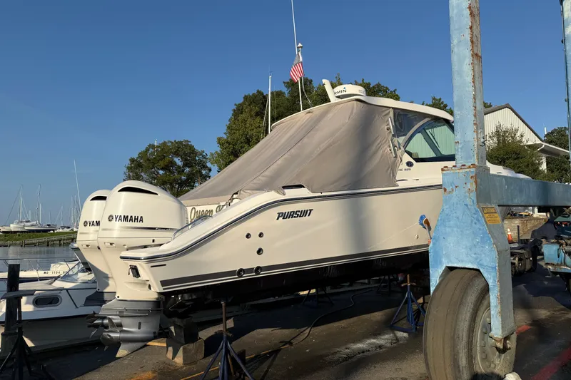  Yacht Photos Pics 2019 Pursuit DC 325 Dual Console boat on lift with Yamaha engines.