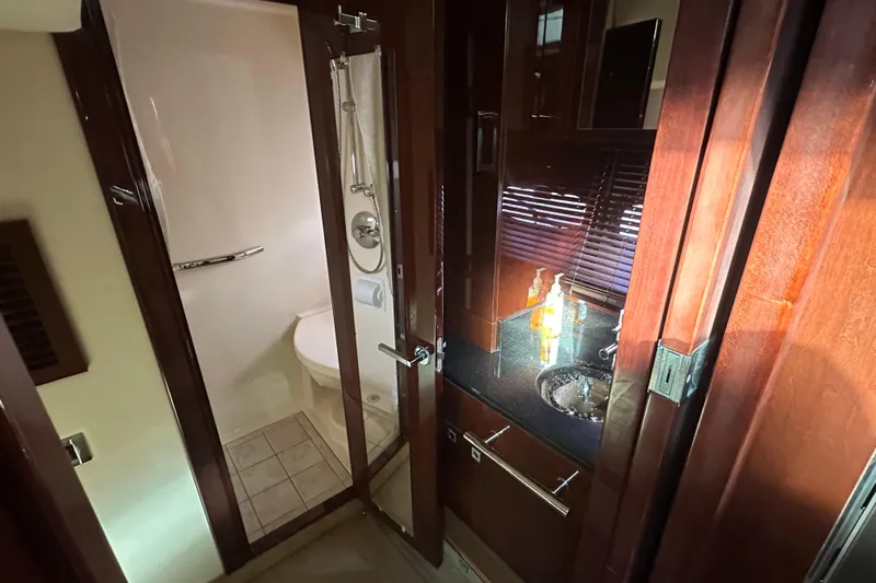  Yacht Photos Pics Luxurious bathroom interior of 2011 Sea Ray 470 Sundancer yacht with modern fixtures.