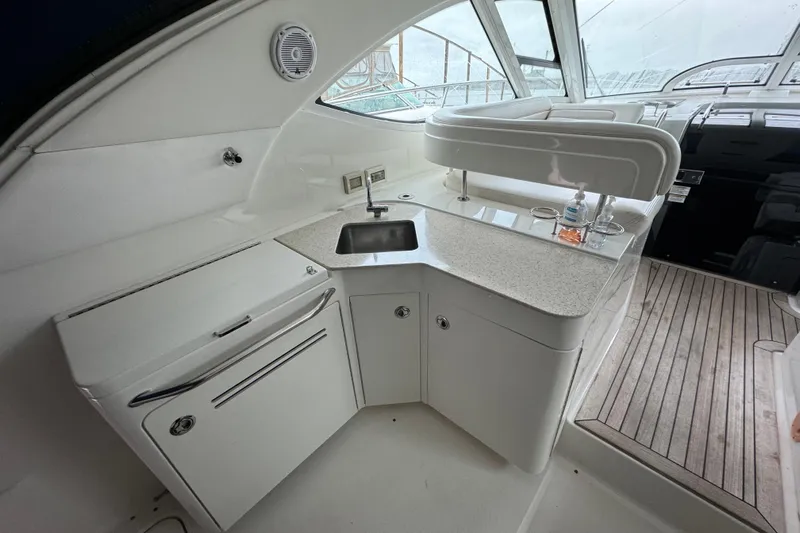  Yacht Photos Pics Luxurious 2011 Sea Ray 470 Sundancer yacht interior with kitchenette and sleek design.