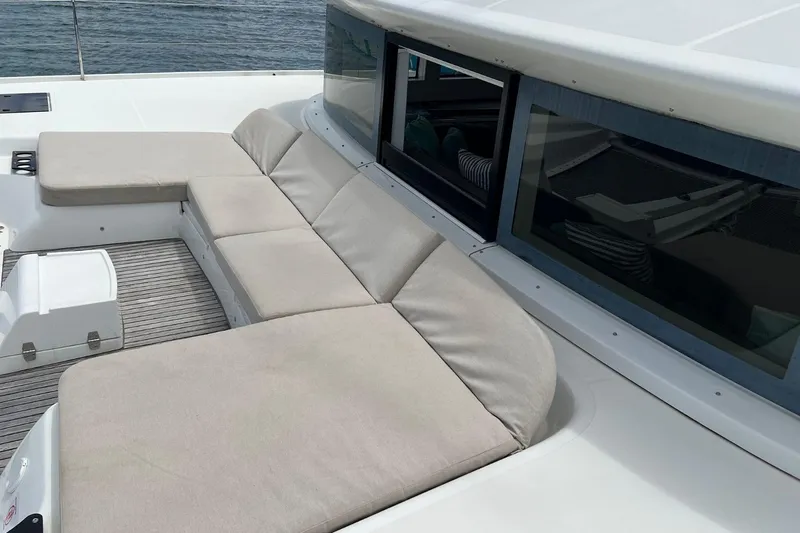 Dignity Yacht Photos Pics Luxurious seating area on a 2021 Lagoon 50 yacht, overlooking the water.