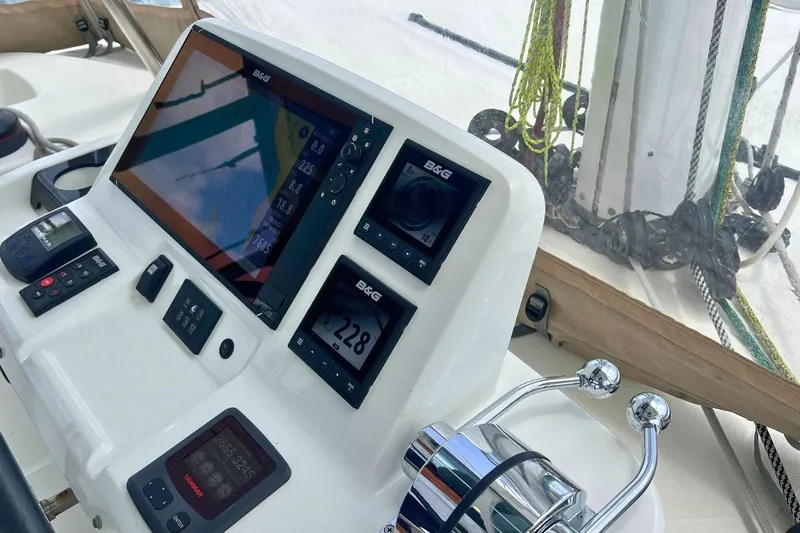 Dignity Yacht Photos Pics Control panel of 2021 Lagoon 50 yacht with navigation instruments and throttle.