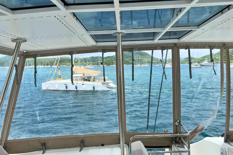 Dignity Yacht Photos Pics View from Lagoon 50 catamaran, 2021 model, overlooking serene bay with sailboats.