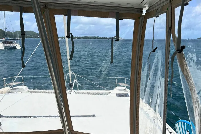 Dignity Yacht Photos Pics View from inside a 2021 Lagoon 50 catamaran, overlooking a serene ocean scene.