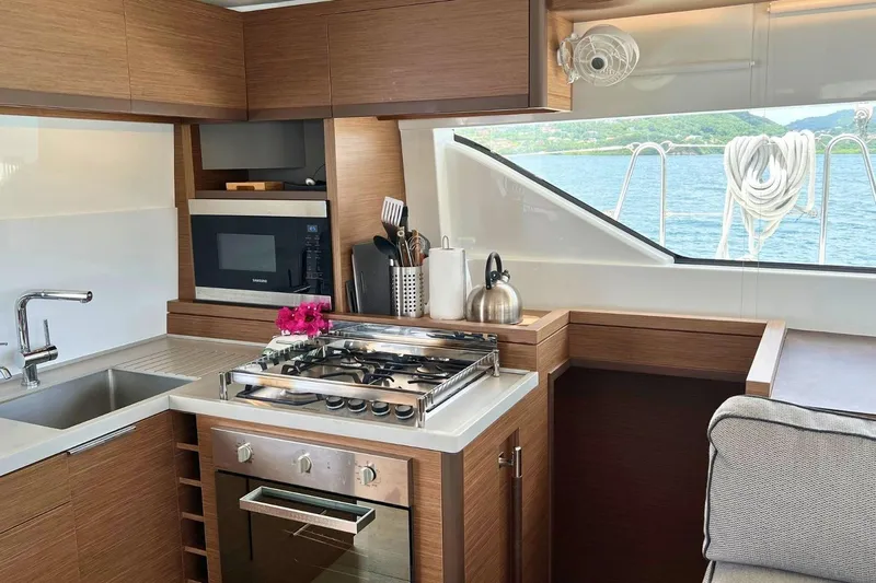 Dignity Yacht Photos Pics Modern kitchen interior on 2021 Lagoon 50 yacht with ocean view.