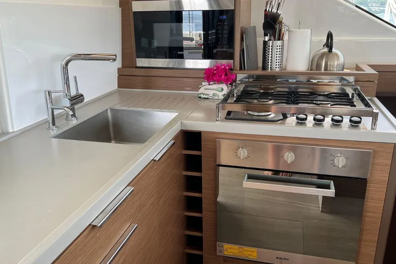 Dignity Yacht Photos Pics Modern kitchen in 2021 Lagoon 50 yacht with stove, oven, and sink.