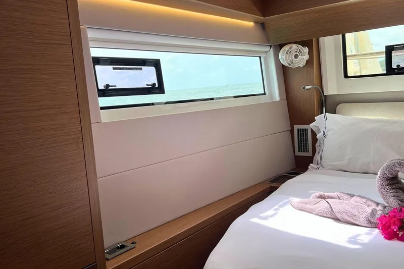 Dignity Yacht Photos Pics Luxurious cabin interior of 2021 Lagoon 50 yacht with ocean view.