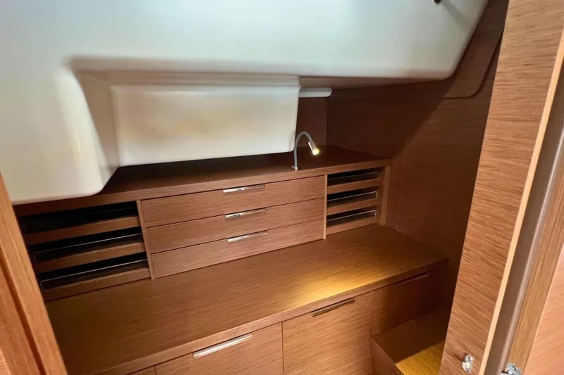 Dignity Yacht Photos Pics Interior of 2021 Lagoon 50 yacht featuring sleek wooden cabinetry and modern design.