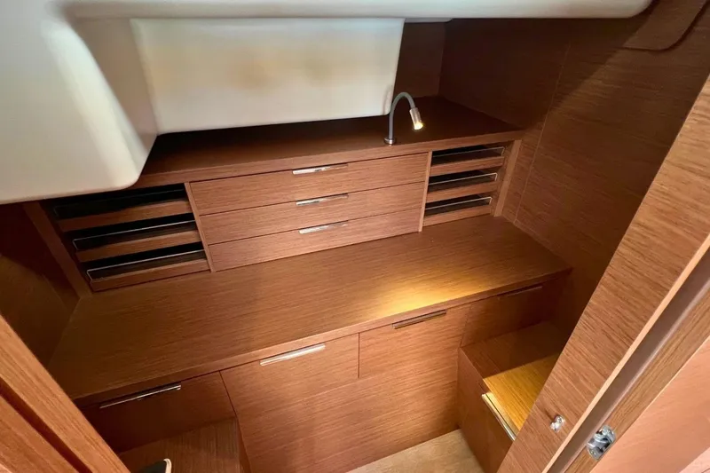 Dignity Yacht Photos Pics Interior of 2021 Lagoon 50 yacht with wooden cabinetry and modern design.