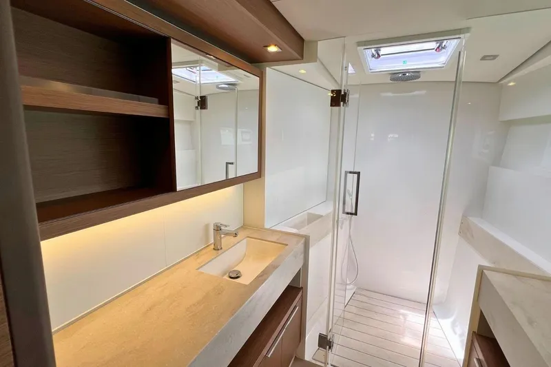 Dignity Yacht Photos Pics Luxurious bathroom in 2021 Lagoon 50 yacht with modern fixtures and spacious shower.