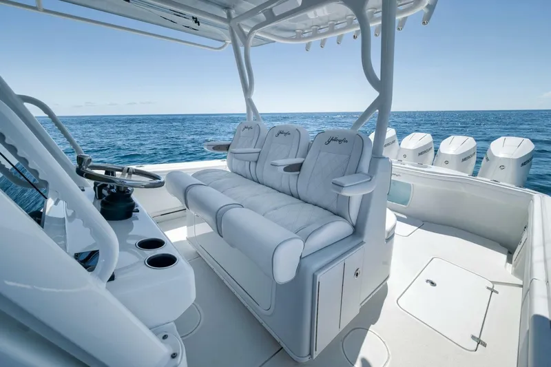  Yacht Photos Pics 2023 Yellowfin 39 Offshore boat interior with luxurious seating and ocean view.