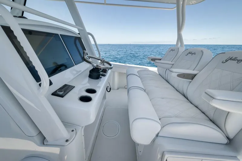  Yacht Photos Pics 2023 Yellowfin 39 Offshore boat interior with luxurious seating and ocean view.