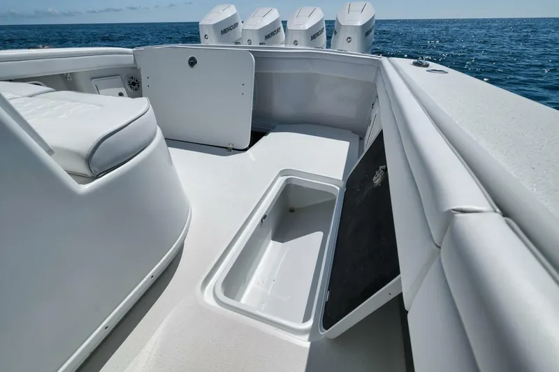  Yacht Photos Pics 2023 Yellowfin 39 Offshore boat interior with storage compartment and Mercury engines.