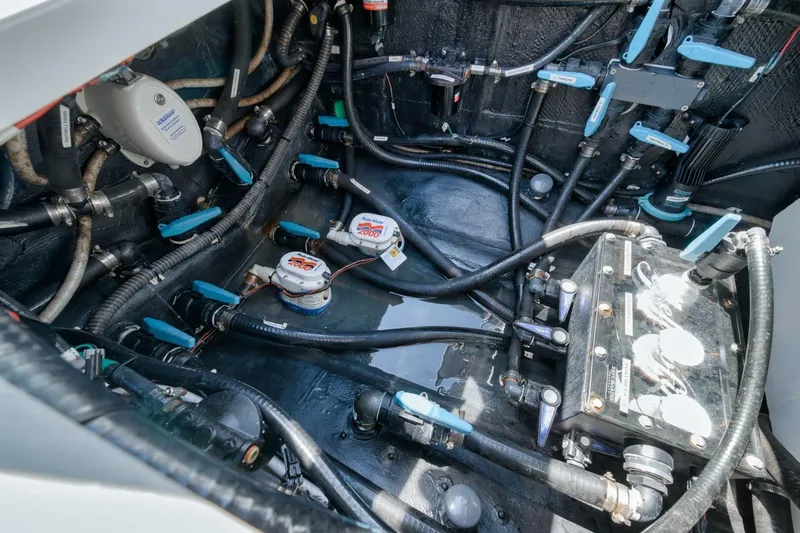  Yacht Photos Pics Engine compartment of 2023 Yellowfin 39 Offshore boat, showcasing intricate wiring and components.