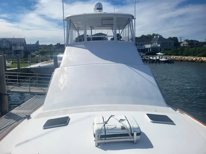 Hailey Girl Yacht Photos Pics 1989 Ocean Yachts 48 docked at a marina, showcasing its sleek white design.