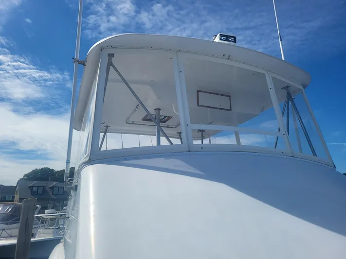 Hailey Girl Yacht Photos Pics 1989 Ocean Yachts 48 boat with clear blue sky background.