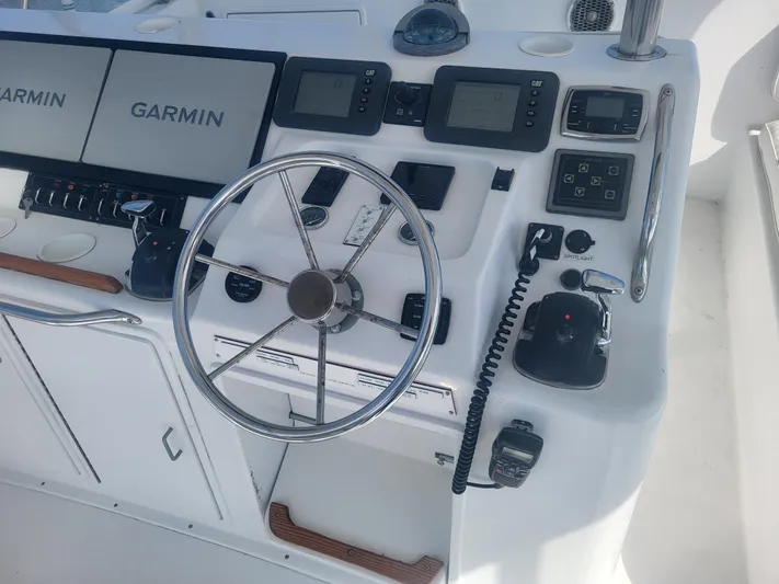 Hailey Girl Yacht Photos Pics Control panel of a 1989 Ocean Yachts 48 with Garmin navigation systems.