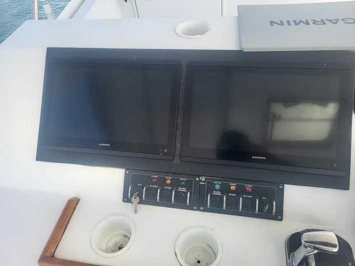 Hailey Girl Yacht Photos Pics Control panel of a 1989 Ocean Yachts 48 with dual Garmin screens.