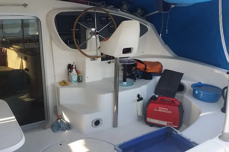 Ocean Mandalay Yacht Photos Pics Cockpit of 2003 Fountaine Pajot Belize 43 catamaran with steering wheel and equipment.
