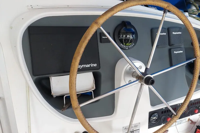 Ocean Mandalay Yacht Photos Pics Steering wheel and navigation panel of 2003 Fountaine Pajot Belize 43 catamaran.