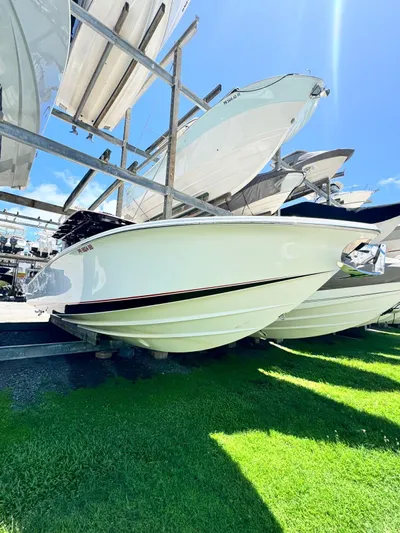  Yacht Photos Pics 2019 Nor-Tech 390 Sport Center Console boat displayed on a rack under clear blue sky.