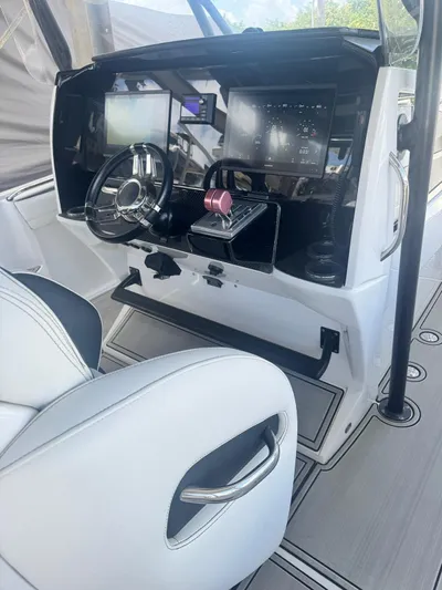  Yacht Photos Pics 2019 Nor-Tech 390 Sport Center Console helm with modern controls and navigation screens.
