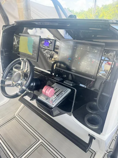  Yacht Photos Pics 2019 Nor-Tech 390 Sport Center Console dashboard with advanced navigation displays.