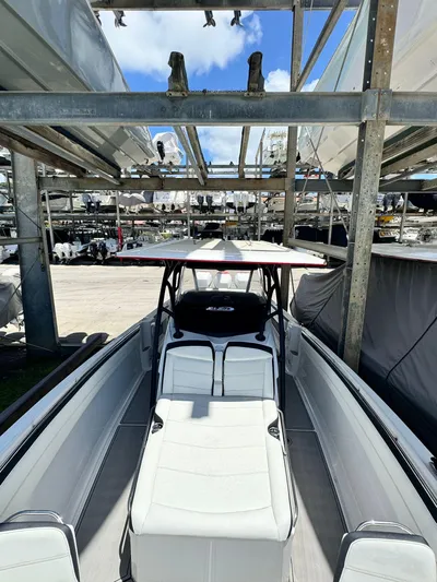  Yacht Photos Pics 2019 Nor-Tech 390 Sport Center Console boat in storage, showcasing sleek design and spacious seating.