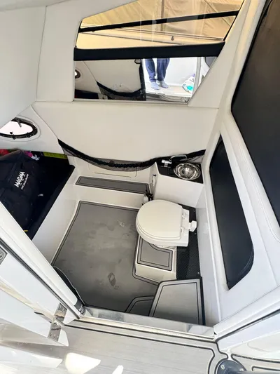  Yacht Photos Pics 2019 Nor-Tech 390 Sport Center Console interior with modern bathroom amenities.