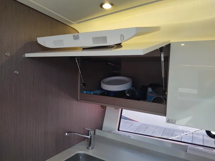 Total Chaos 9 Yacht Photos Pics Total Chaos 9 Galley locker