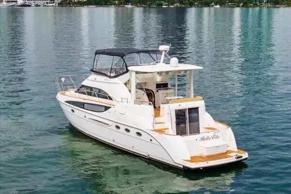 Bella Vita Yacht Photos Pics 2007 Meridian 459 Motoryacht on calm water, featuring sleek design and spacious deck.