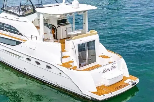 Bella Vita Yacht Photos Pics 2007 Meridian 459 Motoryacht on water, featuring spacious deck and elegant design.