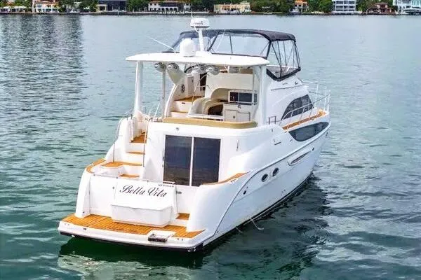 Bella Vita Yacht Photos Pics 2007 Meridian 459 Motoryacht on calm water, featuring elegant design and spacious deck.