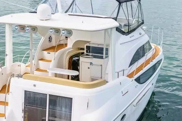 Bella Vita Yacht Photos Pics 2007 Meridian 459 Motoryacht on water, featuring spacious deck and elegant design.