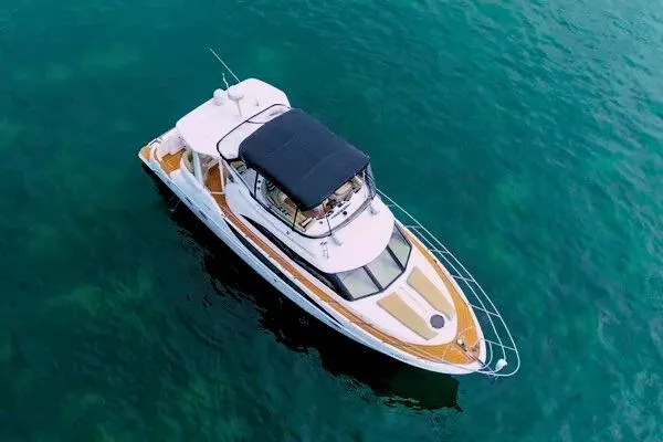 Bella Vita Yacht Photos Pics Aerial view of 2007 Meridian 459 Motoryacht on clear blue water.
