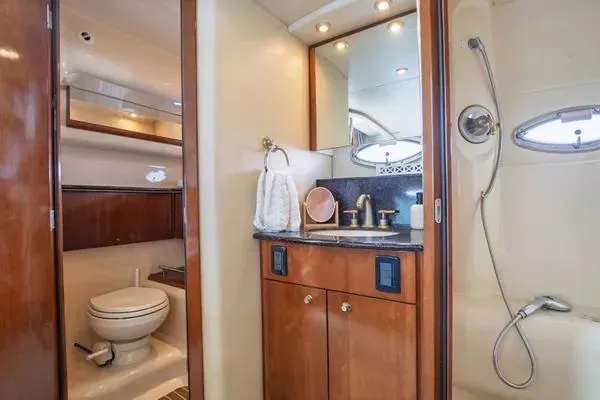 Bella Vita Yacht Photos Pics Luxurious bathroom in 2007 Meridian 459 Motoryacht with wood cabinetry and modern fixtures.