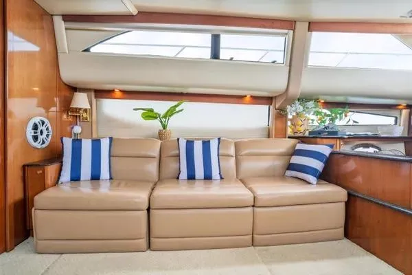 Bella Vita Yacht Photos Pics Luxurious interior of 2007 Meridian 459 Motoryacht with leather seating and striped cushions.