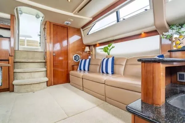 Bella Vita Yacht Photos Pics Luxurious interior of 2007 Meridian 459 Motoryacht with plush seating and elegant decor.
