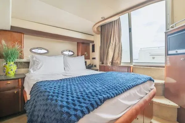 Bella Vita Yacht Photos Pics Luxurious bedroom in 2007 Meridian 459 Motoryacht with cozy bedding and elegant decor.