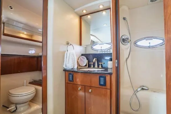 Bella Vita Yacht Photos Pics Luxurious bathroom in 2007 Meridian 459 Motoryacht with shower, vanity, and toilet.