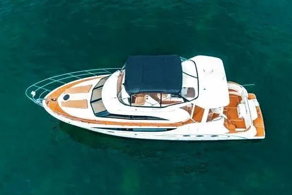 Bella Vita Yacht Photos Pics 2007 Meridian 459 Motoryacht on clear blue water, aerial view.