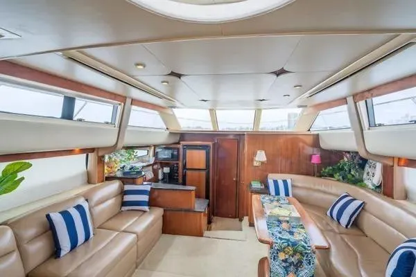 Bella Vita Yacht Photos Pics Luxurious interior of 2007 Meridian 459 Motoryacht with leather seating and nautical decor.