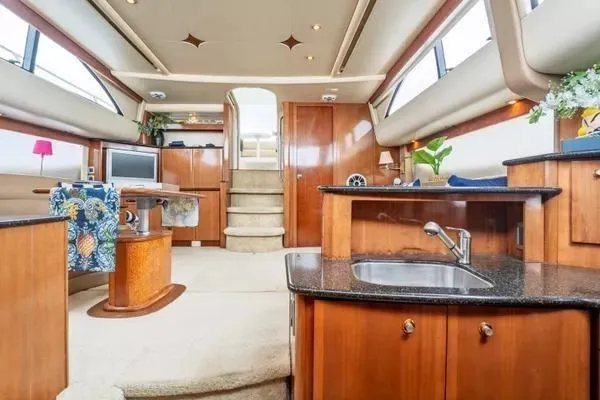 Bella Vita Yacht Photos Pics Luxurious interior of 2007 Meridian 459 Motoryacht with elegant wood finishes and modern amenities.