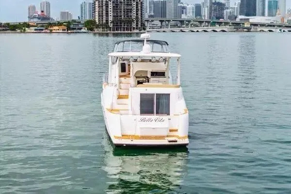 Bella Vita Yacht Photos Pics 2007 Meridian 459 Motoryacht on water with city skyline in background.