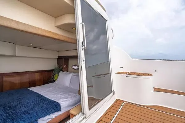 Bella Vita Yacht Photos Pics 2007 Meridian 459 Motoryacht cabin with open door and wooden deck.