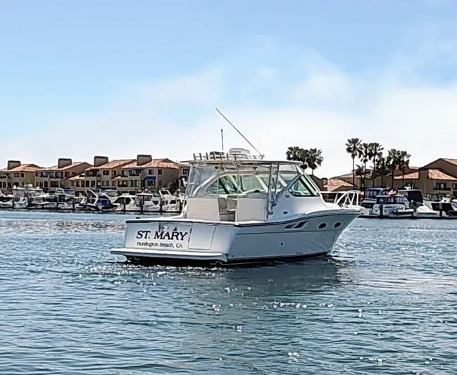 St Mary Yacht Photos Pics 2008 Tiara Yachts 3200 Open boat on water near marina, sunny day.