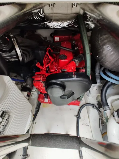 St Mary Yacht Photos Pics Engine compartment of 2008 Tiara Yachts 3200 Open, featuring a red engine and various components.