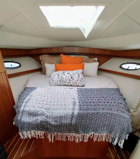 St Mary Yacht Photos Pics Cozy cabin interior of 2008 Tiara Yachts 3200 Open with skylight and decorative pillows.
